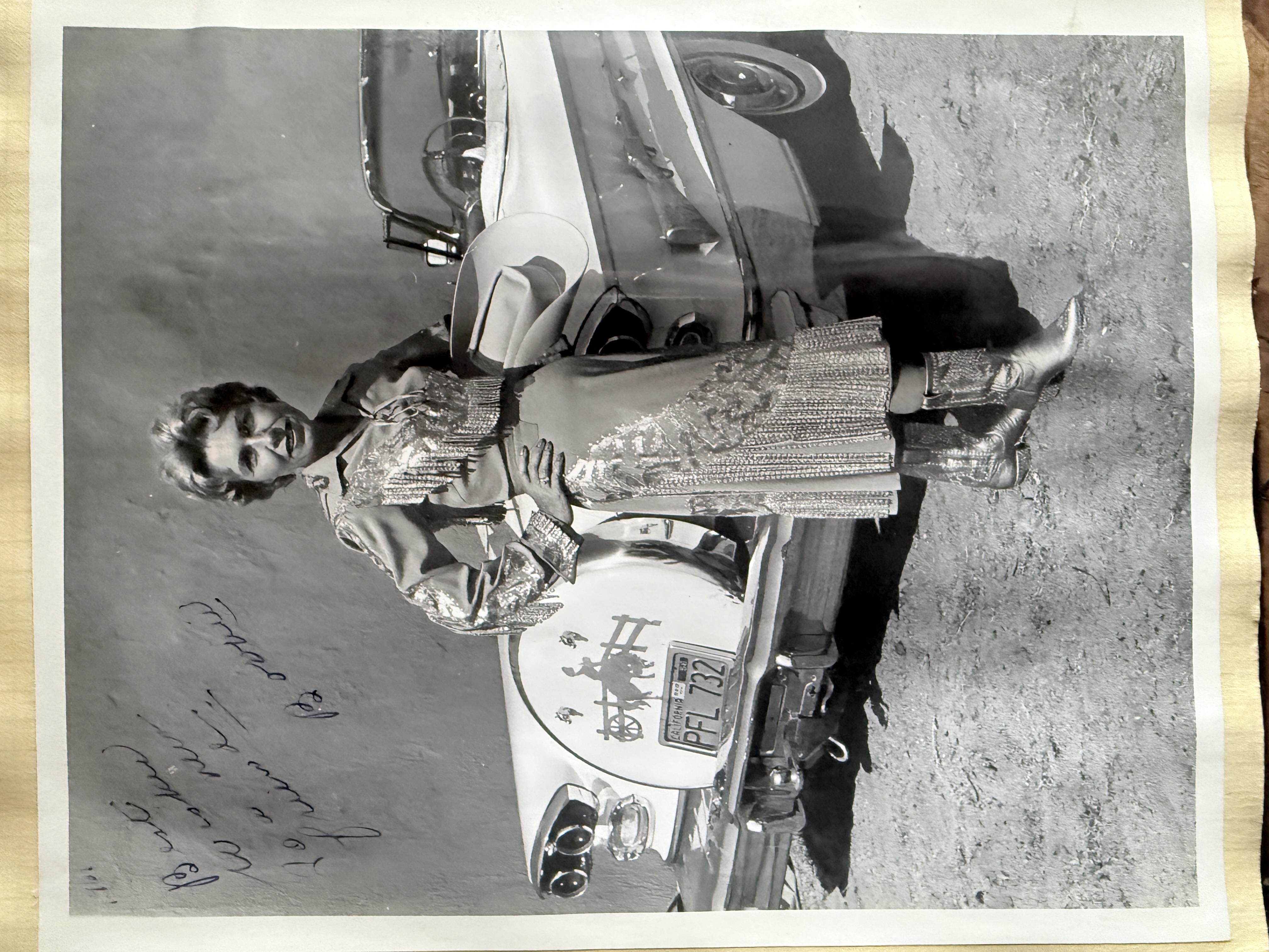 Bobbie Cohn beside an earlier Nudie Mobile