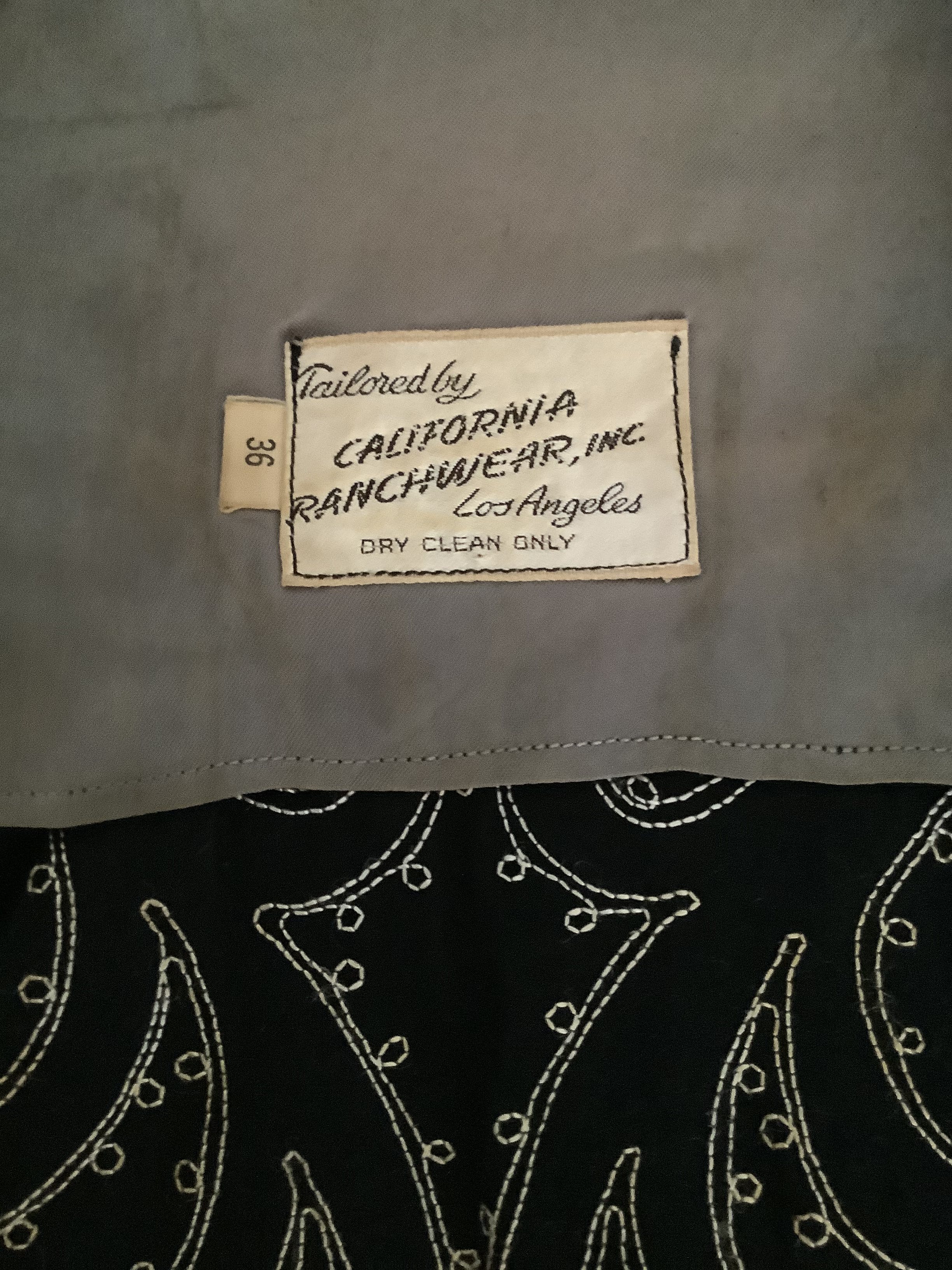 Seller photograph of a sewn California Ranchwear label and size 36 tab.