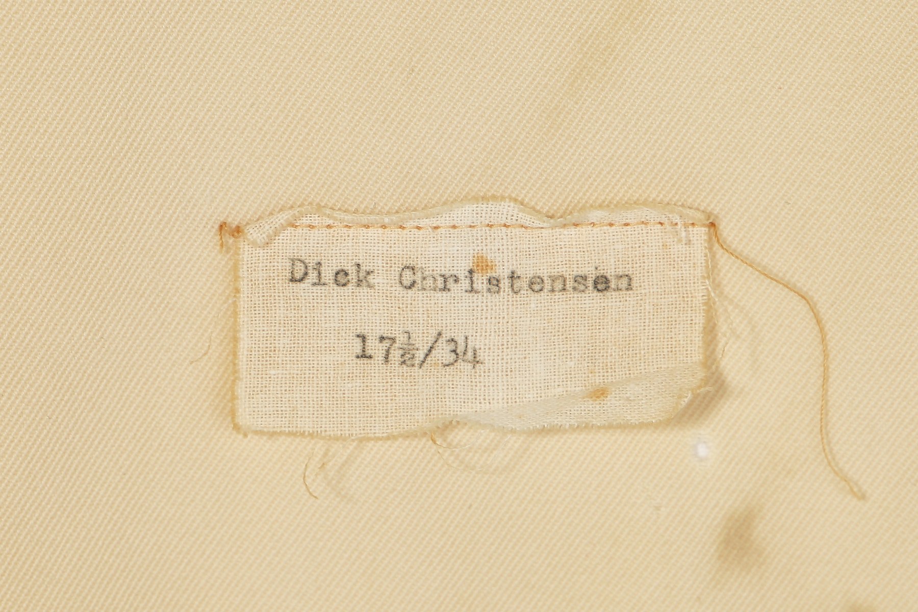 A separate sewn label reads “Dick Christensen” with size figures; it does not establish who wore the shirt.