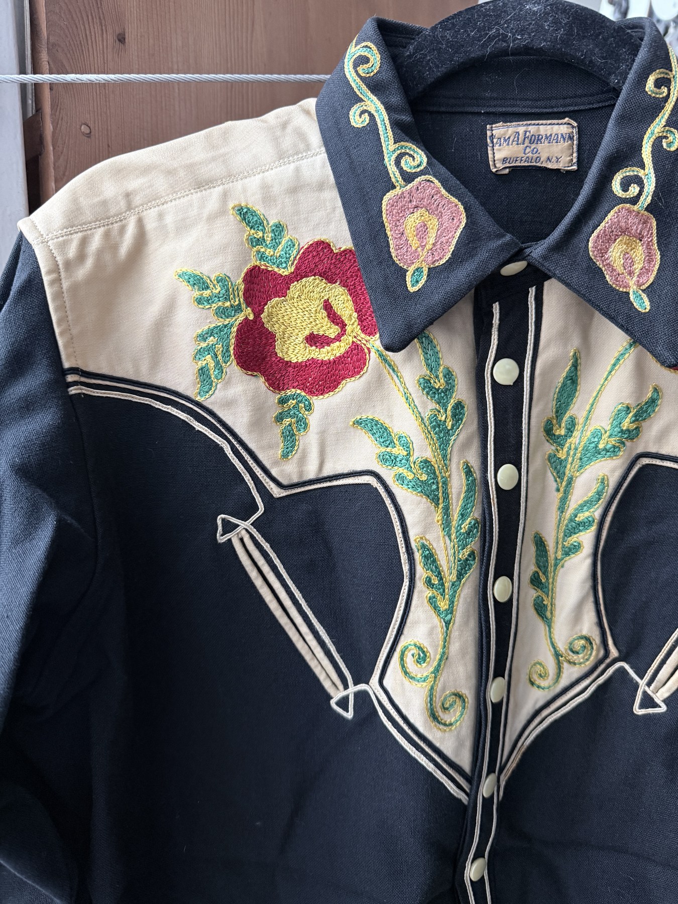 Front and collar view of the Sam A. Formann Co. shirt, showing collar embroidery and the label in place