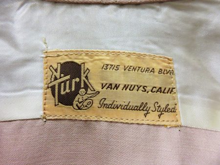 N. Turk label in Chicago History Museum shirt 1979.180.23: 13715 Ventura Boulevard, Van Nuys.