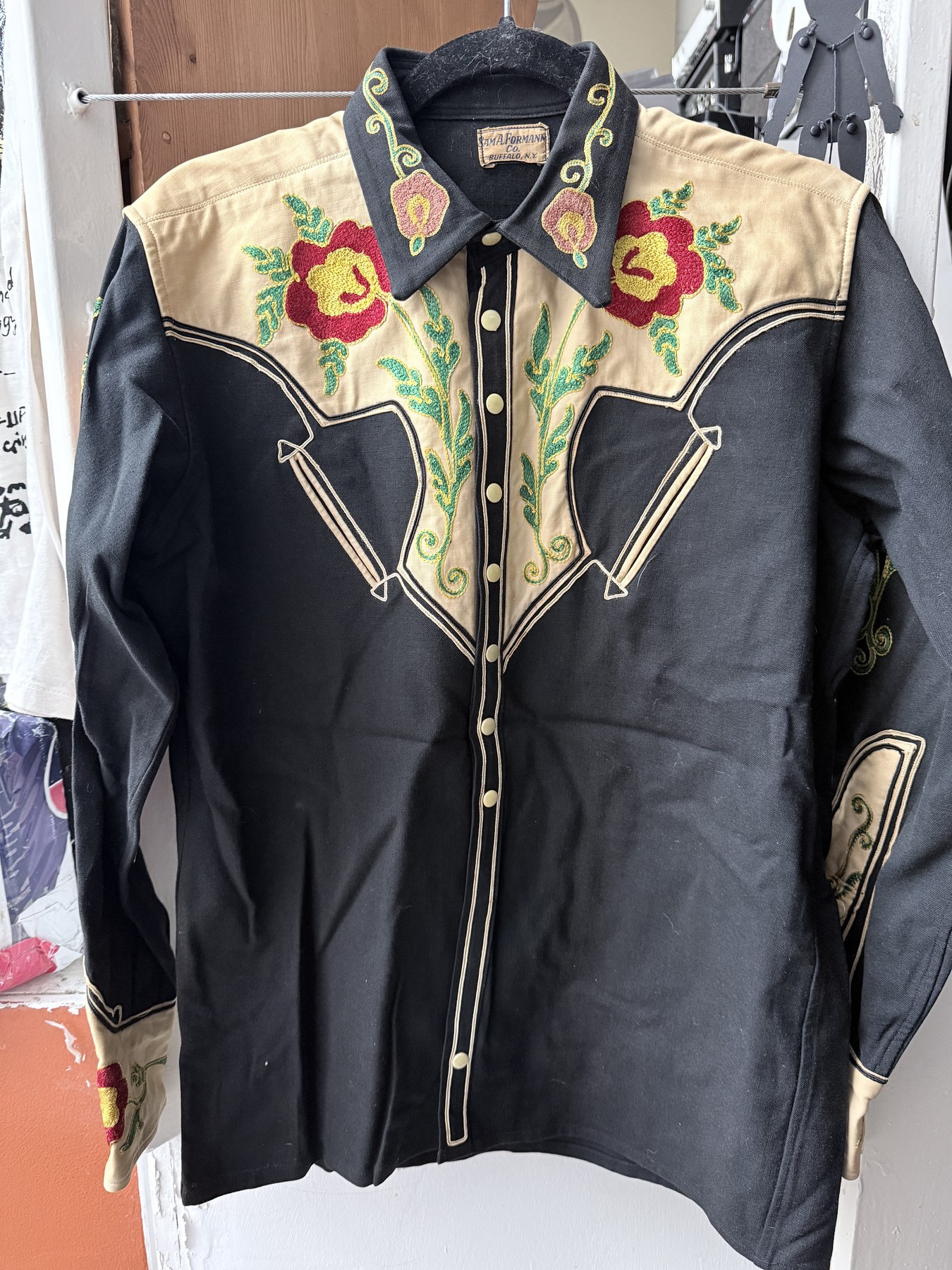 A black-and-cream embroidered Western shirt bearing a Sam A. Formann Co., Buffalo, N.Y. label.