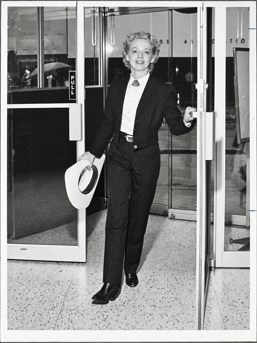 Viola Grae in Houston, photographed by Dell Van Dusen for the Houston Post; the reverse caption identifies her as wearing her Lady Maverick creation.
