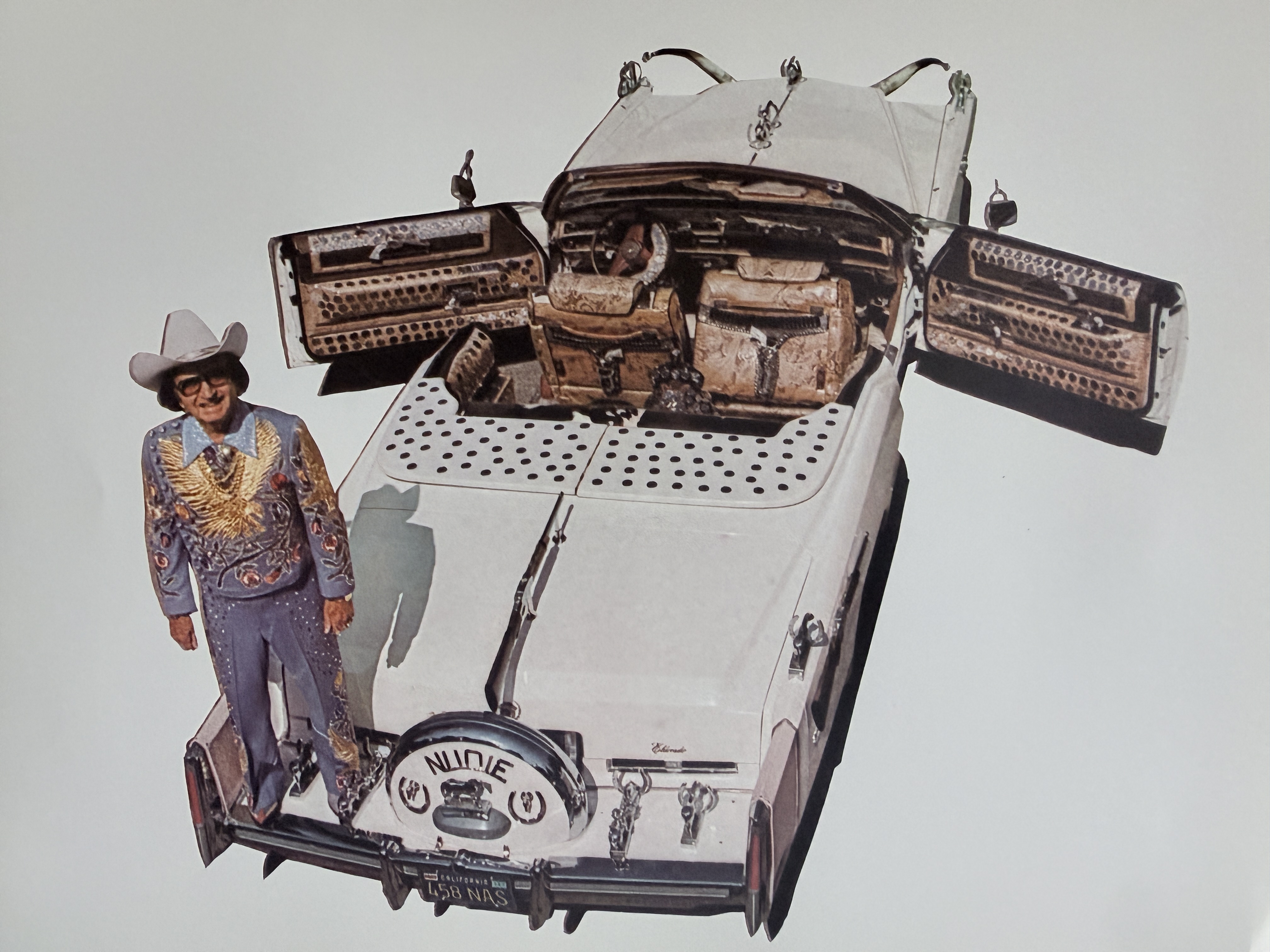 Nudie beside his Cadillac El Dorado