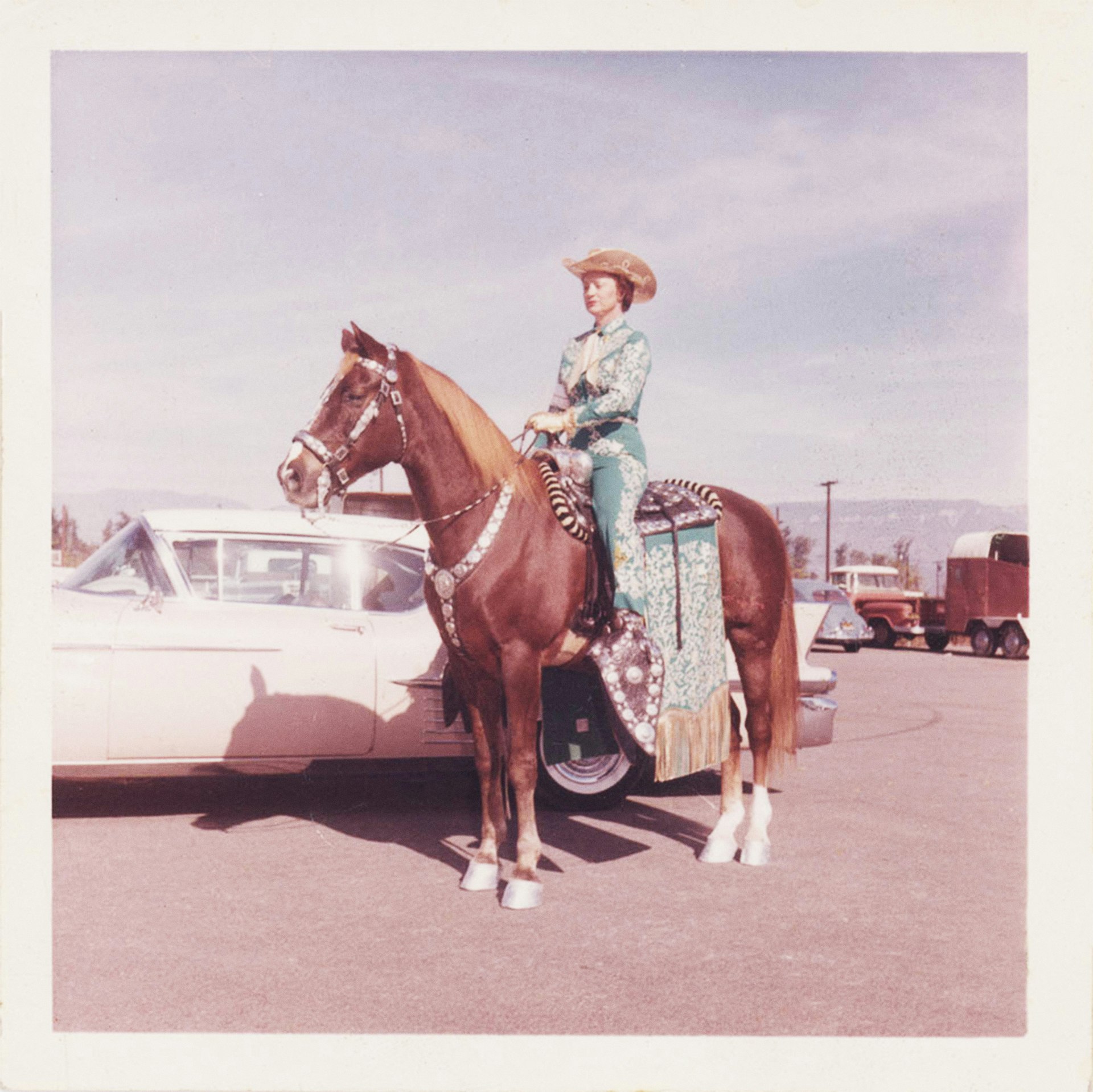 Rodeo parade rider and horse in Nudie-made show clothing