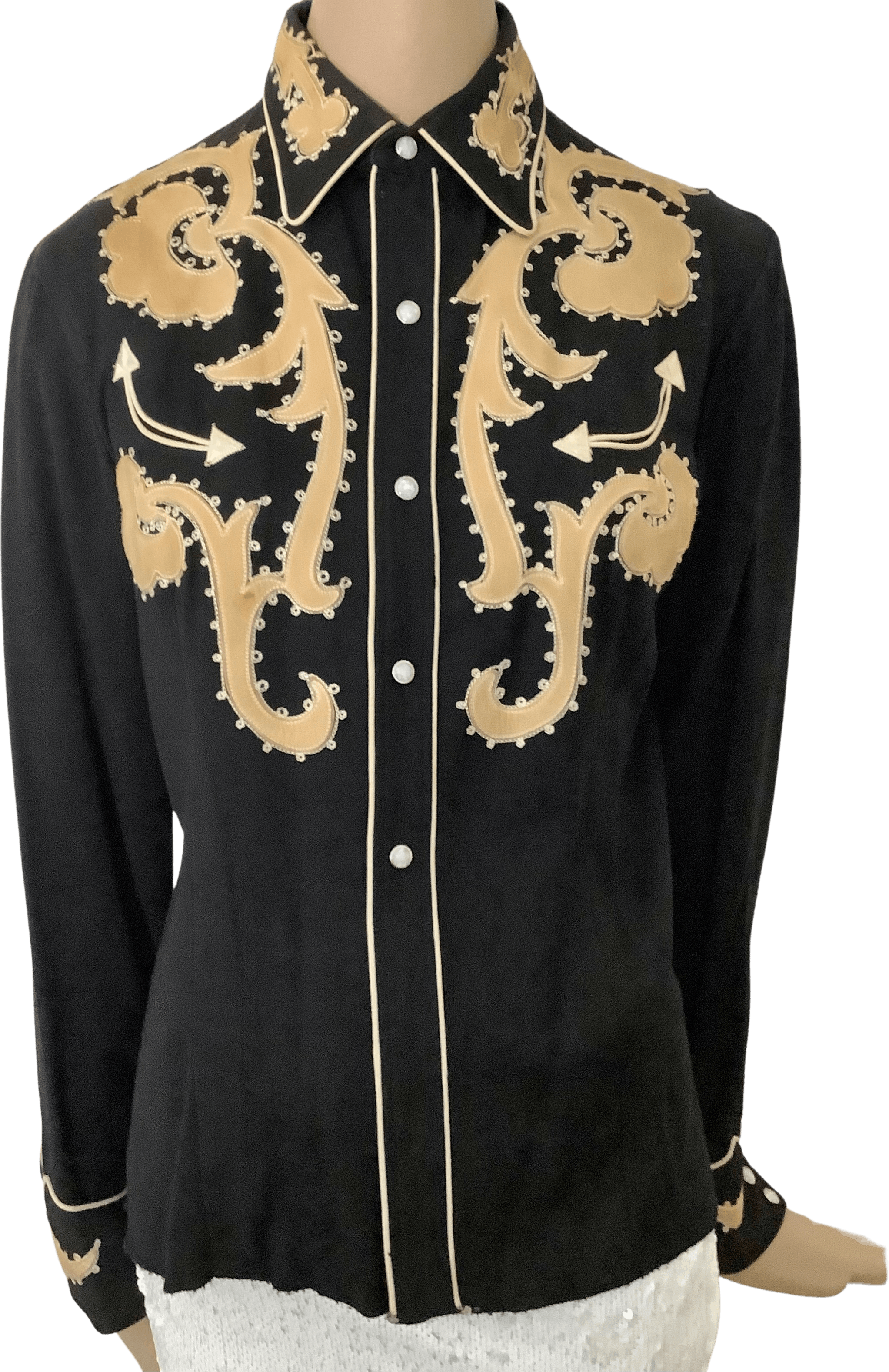 Seller photograph of a black snap-front California Ranchwear shirt with pale applied floral-and-scroll motifs and pale piping.