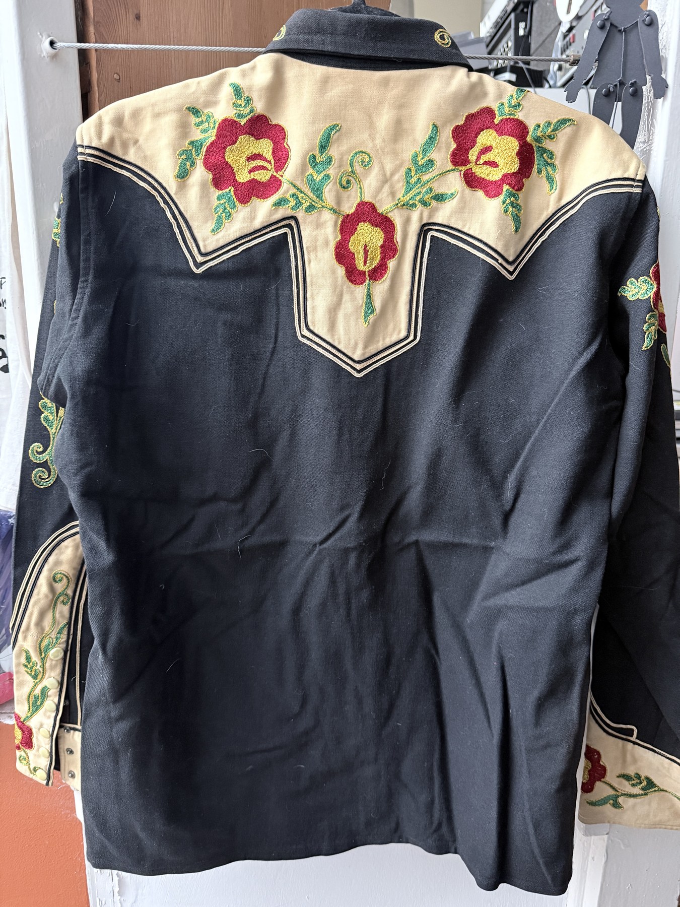Back view of the Sam A. Formann Co. shirt, with rose embroidery across the cream yoke