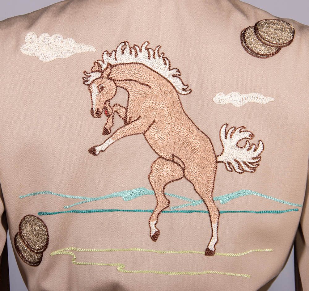 Horse embroidery on the auction-presented outfit